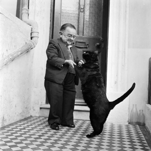 The smallest man in the world dancing with his pet cat
