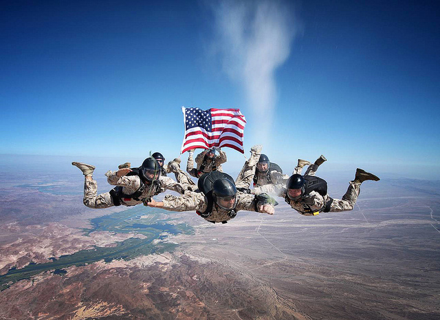 Marines skydiving and spreading the ashes of a fellow fallen Marine in