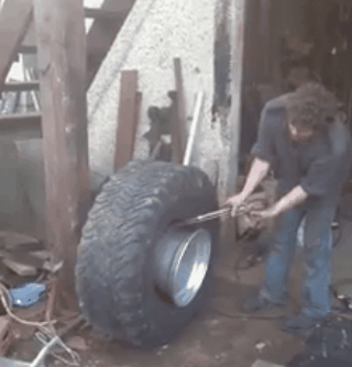 This is the manliest way to put the tire on the rim I have ever see