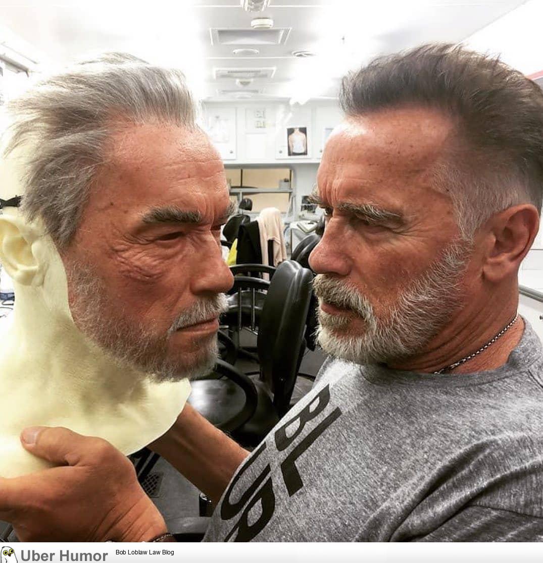 Arnold Schwarzenegger Holding A Lifelike Stunt Double Mask Funny Pictures Quotes Pics Photos Images Videos Of Really Very Cute Animals