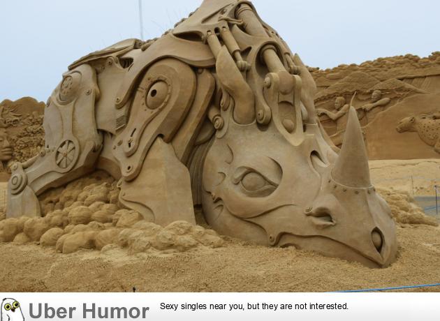 An extremely realistic mechanical rhino sand sculpture | Funny Pictures,  Quotes, Pics, Photos, Images. Videos of Really Very Cute animals.
